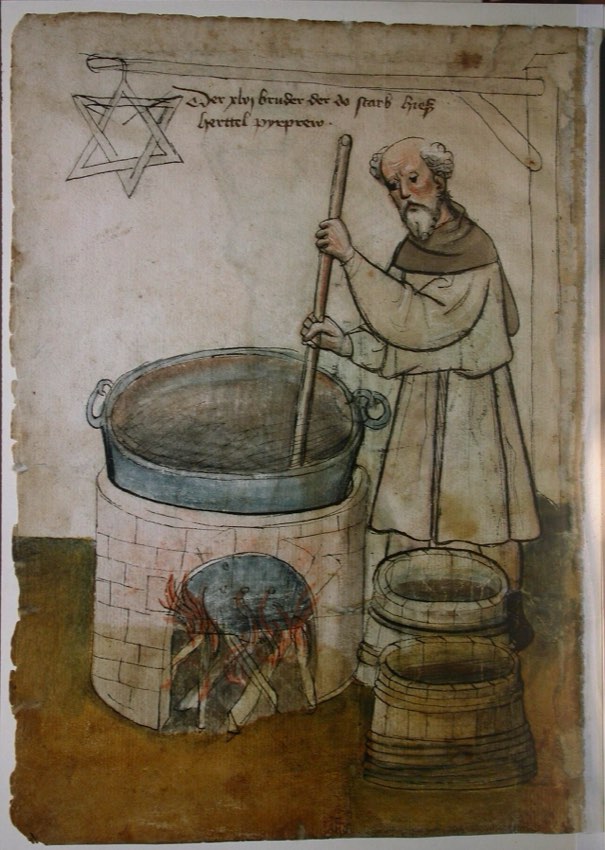 A brewer in a long robe stirs a large vat set over an open fire, with wooden barrels beside him and a six-pointed star hanging above.
